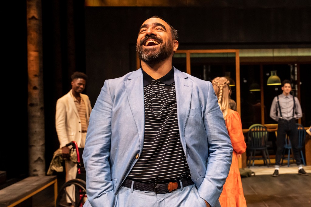 Benedick is all smiles, laughing about something as usual, with Claudio, Hero, and Oatcake in the background.
