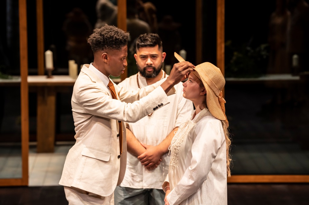 The revelation that Hero is still alive at the end of the play, with Claudio lifting Hero's broad hat. Claudio, Hero, and the Friar are all dressed in shades of white and cream